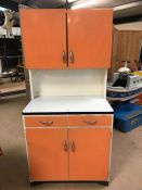 Retro Mid Century kitchen cabinet with orange paint finish, larder cupboard to top, two drawers