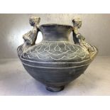 In the style of Thracian / Ancient Greek pottery, a vase for mixing wine and water embossed with two