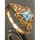 9ct Gold ring set with a Blue Topaz approx 5mm square in ornate pierced setting size 'P'