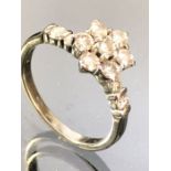 14ct Gold Diamond Daisy Head Cluster ring set with a pair of Diamonds to each shoulder. Seven