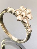 14ct Gold Diamond Daisy Head Cluster ring set with a pair of Diamonds to each shoulder. Seven
