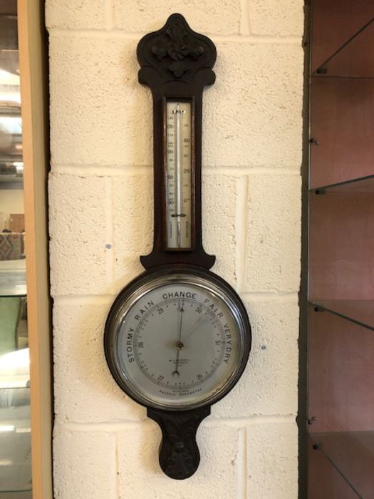 Aneroid barometer by W. J. Carroll, approx 79cm in length