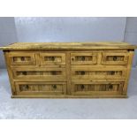 Mexican pine chunky modern sideboard with eight drawers and metal ring handles, approx 170cm x