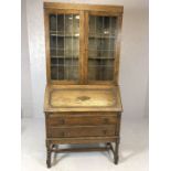 Oak bureau bookcase with glazed cupboards over and two drawers under, approx 91cm x 43cm x 194cm