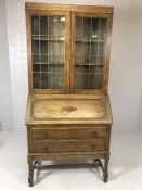 Oak bureau bookcase with glazed cupboards over and two drawers under, approx 91cm x 43cm x 194cm