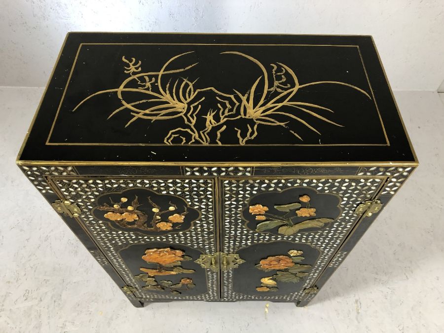 Oriental lacquered cabinet with with applied floral design, approx 60cm x 31cm x 90cm tall - Image 2 of 7