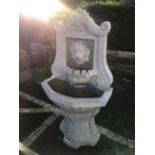 Two tier Garden water feature with lion's head design, approx height 128cm