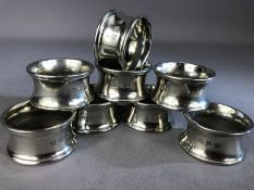 Good collection of six silver coloured heavy napkin rings by John Somers