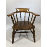 Smokers bow elbow chair, with spindle back raised on turned legs