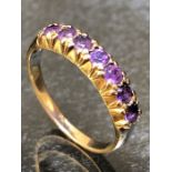 9ct Gold ring set with seven Amethyst stones size 'N'