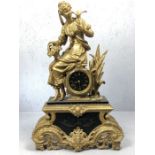 Gilt and spelter clock, depicting a lady feeding a bird. French barrel movement, lightly bells the