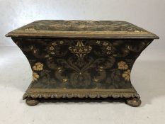 Antique upholstered, heavily carved ottoman, with padded seat opening to reveal green silk lining (