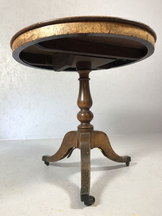 Victorian tilt-top table on splayed tripod legs with original castors, by Holland and Sons of - Image 2 of 5