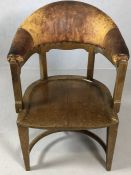 Substantial wooden framed armchair with sweeping leather arms and back