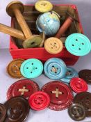 Collection of vintage items to include bobbins, giant buttons and a magnetic globe, in a red painted