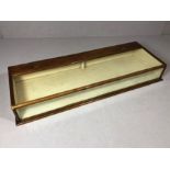 Victorian counter top display case with hinged glass lid and glass front, two doors with brass