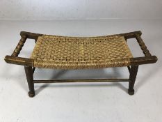 Oak framed rush seated bench / stool on turned tapering legs with bobbin turned handles, approx 85cm