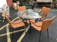 Modern rattan, metal-framed and glass topped garden set to include four chairs and table