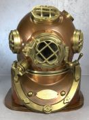 Brass and copper U.S. Navy diving helmet, labelled Mark V Morse Diving Equipment Co. Boston Mass,