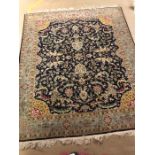 Large blue and green ground rug with gold borders and fringe, approx 270cm x 330cm