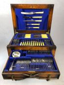Twelve place setting cutlery set by Thomas Ward and Sons, Sheffield, contained within an oak canteen