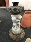 Stone birdbath with cherubs, approx 60cm tall