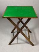 Folding card table with brass corners and green baize