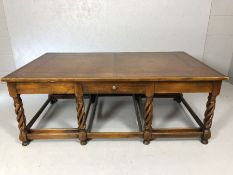 Large leather topped coffee table with drawers to each long side and spiral carved legs with large