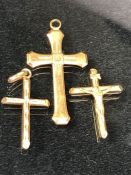 Three 9ct gold crucifix pendants approx 2.7g