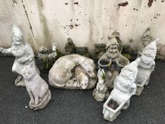 Collection of concrete garden ornaments to include gnomes, otters, rabbits, cat etc