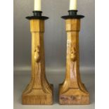 Pair of Robert 'Mouseman' Thompson oak candlesticks with iron sconces, of octagonal column form on