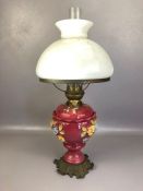 Victorian brass and ceramic oil lamp with floral design, metal foliate base, opalescent shade and