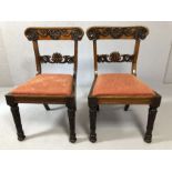 Pair of heavily carved antique chairs with fluted legs