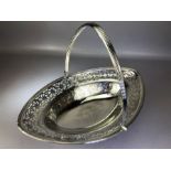 Large George III Hallmarked Silver basket with hinged handle and pierced decoration on galleried