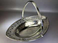Large George III Hallmarked Silver basket with hinged handle and pierced decoration on galleried