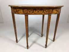 Inlaid occasional table of oval form with inlaid and six tapering legs, approx 81cm x 42cm x 69cm