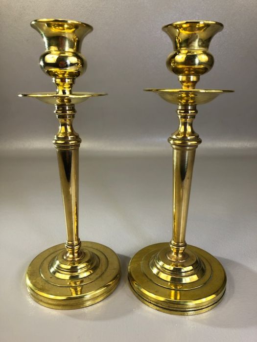 Pair of Arts and Crafts brass candlesticks with weighted bases, approx 22cm in height