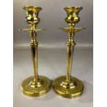 Pair of Arts and Crafts brass candlesticks with weighted bases, approx 22cm in height