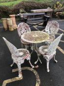 White metal circular garden table with four chairs, diameter approx 69cm