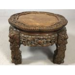 Heavily carved Chinese low table with dragons and floral design, approx 47cm x 47cm x 35cm tall