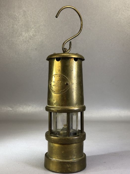 Brass miner's lamp by the Lamp & Limelight Company, Hockley, approx 17cm in height (excluding hook)