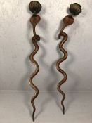 Pair of metalwork cobra wall sconces with red and black painted design, approx 77cm tall