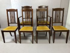 Set of six dining chairs to include two carvers with mustard yellow seat pads