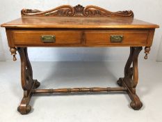 Two drawer console or hall table with carved upstand, turned stretcher and scroll feet, approx 110cm