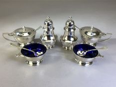 Six piece Silver Hallmarked cruet set London 1916 with blue glass liners Silver spoons & salt &