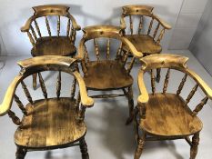 Five substantial elbow chairs on turned splayed legs with Chinese character marks to backs