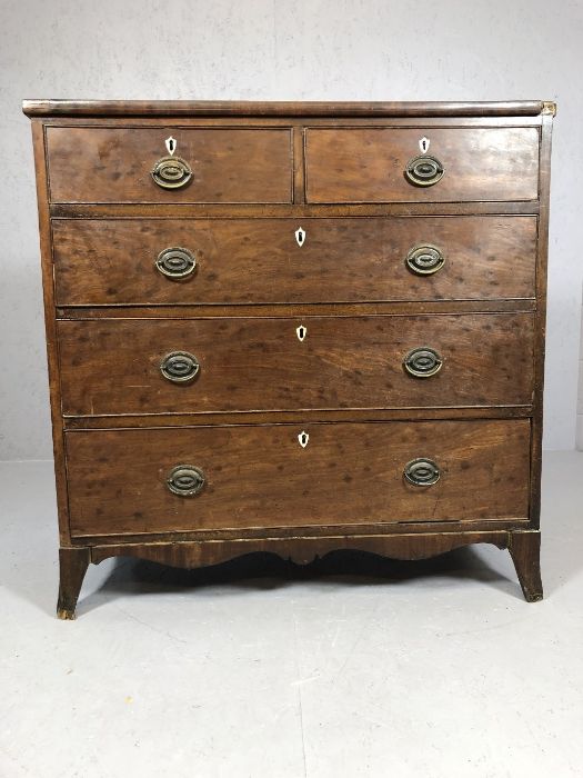 Antique pine and mahogany chest of drawers with original brass handles and shield design escutcheons