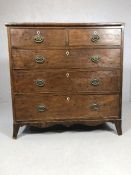 Antique pine and mahogany chest of drawers with original brass handles and shield design escutcheons