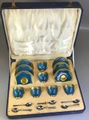 Cased Royal Worcester set of six coffee cans and saucers, decorated with teal ground and a band of