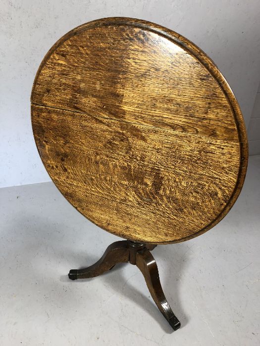 Victorian tilt-top table on splayed tripod legs with original castors, by Holland and Sons of - Image 4 of 5